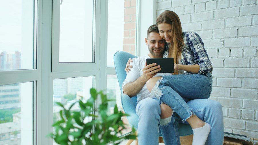 Couple looking at a tablet screen together